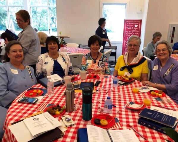 Group seated around a table.